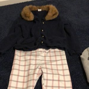 Plaid pants with navy cardigan with fur collar